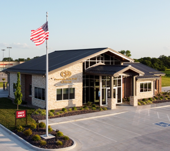 Bank building exterior with flag